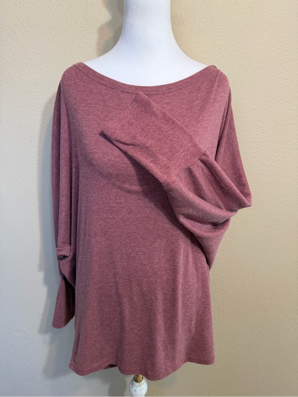 Women’s mauve batwing top features a relaxed silhouette and fitted cuffs